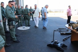 Members of the Maui Police Department's Special Response Team were on hand to demonstrate some of the tools used by the department, including a remote controlled robotic device.  Photo by Wendy Osher.