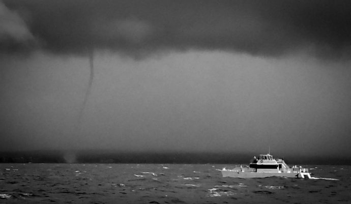 Water Spout seen off shore from McGegor Point: Photo by Captain Drew Sulock of the Pacific Whale Foundation, Maui.
