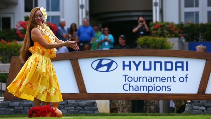 A traditional Haiwaiian dancer performs at the start of round one of the Hyundai Tournament of Champions at the Plantation Course at Kapalua Golf Club on Friday, Jan. 3. Photo by Tom Pennington/Getty Images.