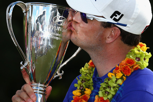 Zach Johnson kisses the trophy after winning the Hyundai Tournament of Champions at the Plantation Course in Kapalua on Monday, Jan. 6. Photo by Tom Pennington/Getty Images.