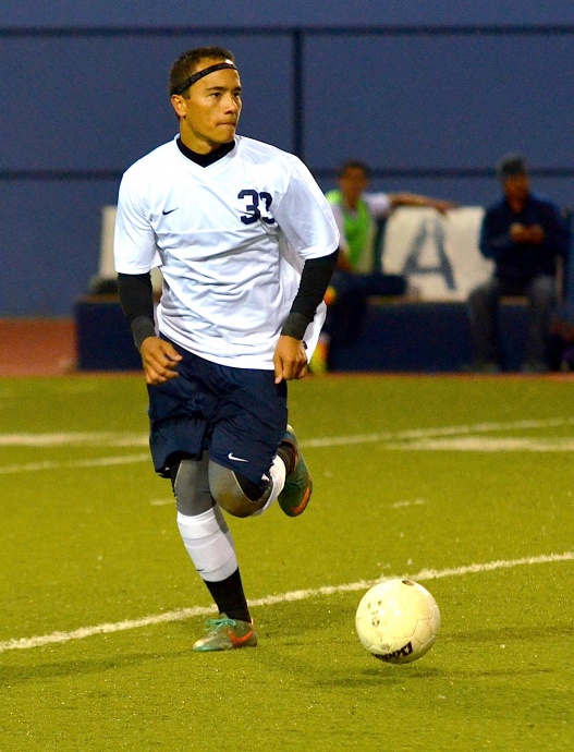Kamehameha Maui senior midfielder Kailoa Akoi scored the Warriors first goal Wednesday against Mililani in the third minute of the match. File photo by Rodney S. Yap.