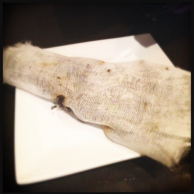 Inside this rag is a smoldering chunk of dry rosemary. Photo by Vanessa Wolf