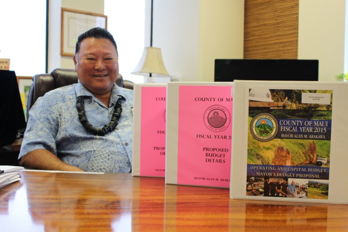 Maui Mayor Alan Arakawa with his version of the Fiscal Year 2015 Budget. Photo by Wendy Osher.