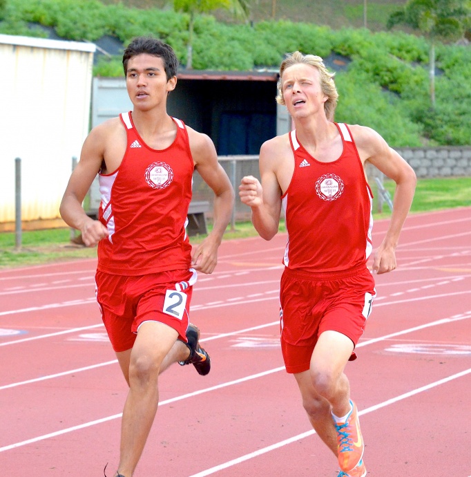 Lahainaluna High Schools' Will Thorbecke beat teammate Corban Kaikkonen (right) in the boys 1,500-meter run Friday. The two are pictured here running side by side in a meet earlier this year. Photo by Rodney S. Yap.