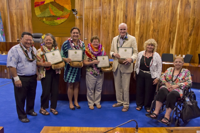 Mayor Alan Arakawa, Council Chair Gladys Baisa (seated) and CSW Chair Barbara Potopowitz (2nd from right) congratulate the recipients of the 2014 “Women of Excellence” Awards. Honorees L-R: Alberta DeJetley, Sheri-Ann Daniels, Agnes Groff, and Paul Janes-Brown. Photo courtesy: County of Maui / Ryan Piros.