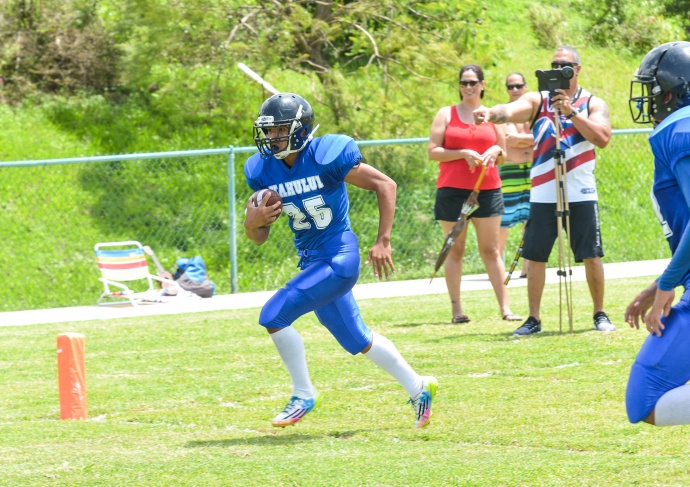 Kahului Falcons' Mosese Aholelei scores one of his three touchdowns Saturday against Kihei. The 8th-grader from Maui Waena scored on a pass reception, a running play and on a punt return. Photo by Rodney S. Yap.