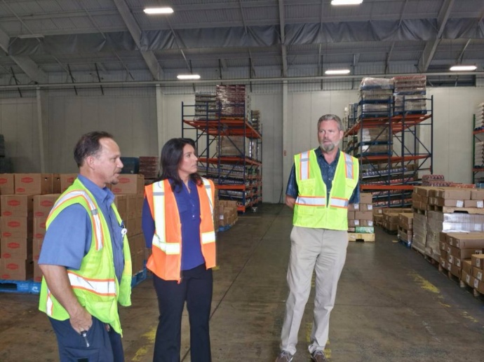 Congresswoman Tulsi Gabbard tours the Pepsi Beverages Company facility on Maui and learns how it is providing jobs for local residents. 10/30/14, courtesy photo.
