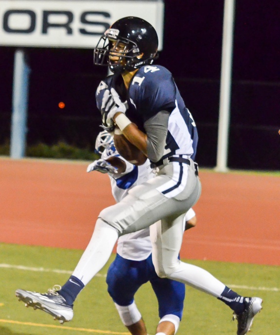 Kamehameha Maui's Keoni Keanini (14) squeezes this 22-yard touchdown pass from quarterback Chase Newton Saturday night. Photo by Rodney S. Yap. 