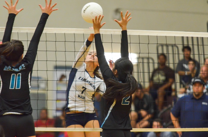 Kamehameha Maui's Danielle Brown with one of her 14 kills Friday against King Kekaulike's Brennalye Rodrigues (11) and Victoria Knish (2). Photo by Connor Yap.