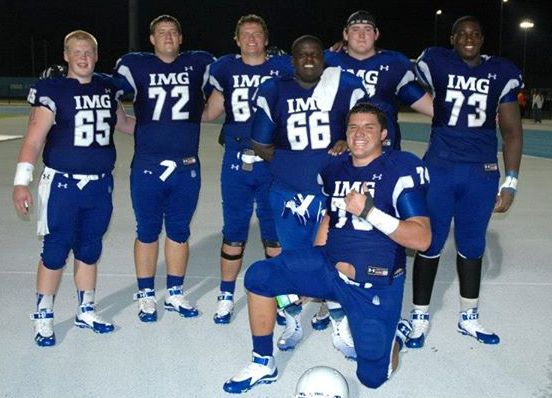 Miki Fifita (kneeling) poses with several offensive teammates after a game at the IMG Academy earlier this season. IMG Academy photo.