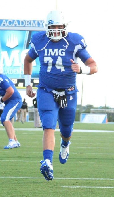 Miki Fifita warming up at IMG Academy before a home game earlier this year. IMG Academy photo.