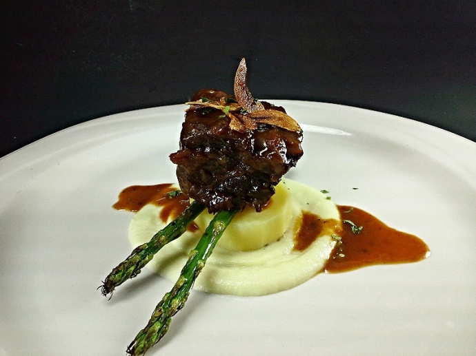 Braised Short Ribs, Truffle Parsnip Puree, Asparagus with Roasted Rosemary Potatoes and Garlic Chips. Courtesy image.