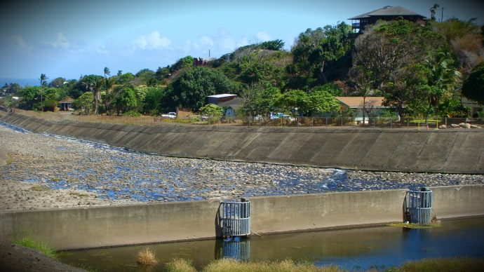 In order for continuous flow downstream, water must get past a diversion near Happy Valley operated by Hawaiian Commercial and Sugar Company. File photo by Wendy Osher.