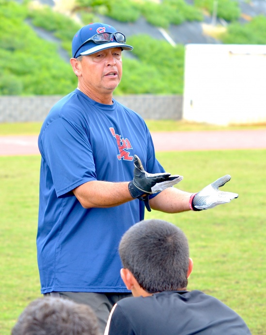 Quarterback coach Vince Passas at last year's free clinic on Maui. File photo by Rodney S. Yap.