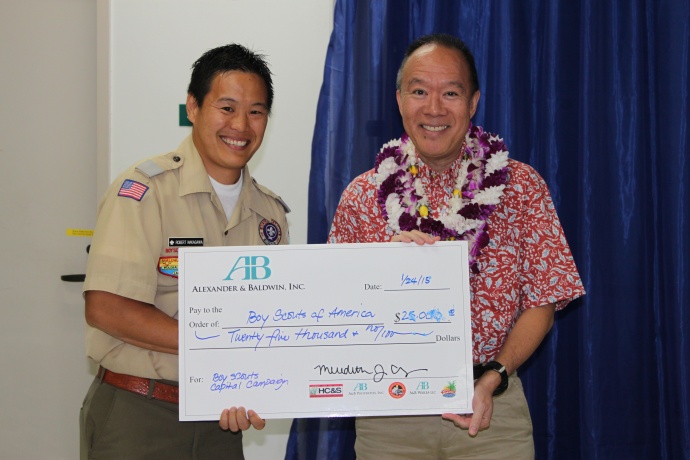 Newly Elected President Grant Chun (right) of A&B Properties presents a $25,000 donation check to Scout Executive Robert Nakagawa (left) for the Camp Maluhia Capital Campaign. Courtesy photo.