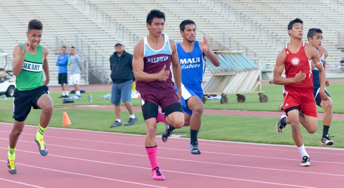 Baldwin's Bailey Kaopuiki leads the field in the boys 100-meter dash Saturday at the finals of the Yamamoto Invitational. Photo by Rodney S. Yap.