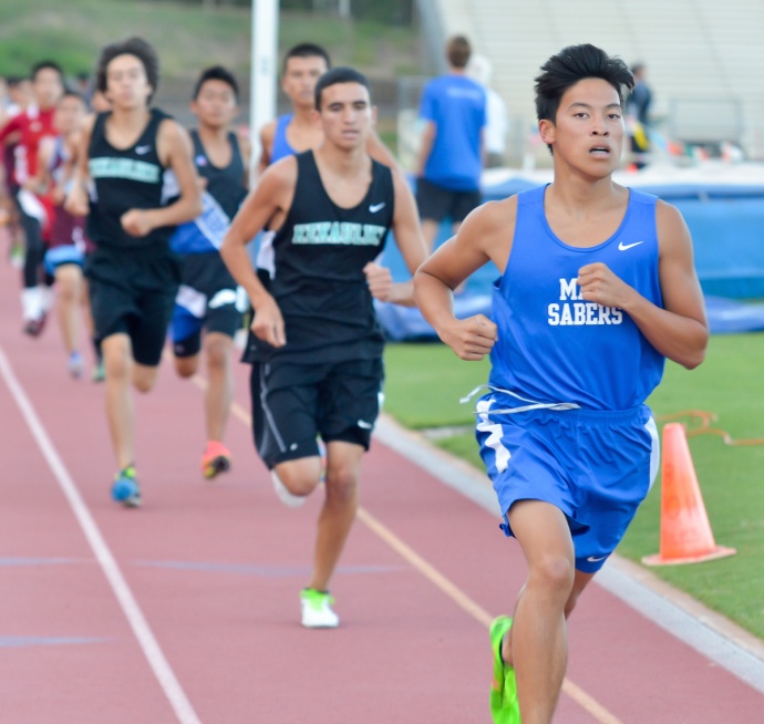 Maui High's Ryan Tsang leads the pack after the first lap of the boys 1,500-meter run Friday. Tsang won the race in 4:31.35. Photo by Rodney S. Yap.