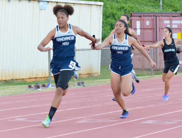 Kamehameha Maui's Selai Damuni hands the baton off to anchor runner Kimani Fernandez-Roy in the girls 4 x 100 relay Friday. Photo by Rodney S. Yap.