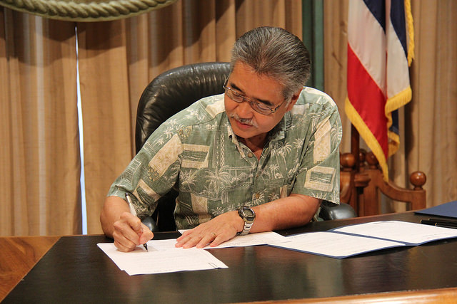 Governor Ige signs a bill into law that designates the ōpe‘ape‘a or Hawaiian Hoary Bat as the official state land mammal in Hawai‘i.  Photo courtesy Office of the Governor, State of Hawai‘i.