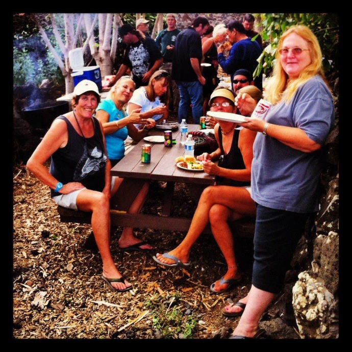 Margo pictured (front left in black tank top) with other volunteers while she was volunteering at the  ʻĀhihi Kīnaʻu Natural Area Reserve as a volunteer interpretive guide.  Courtesy photo.