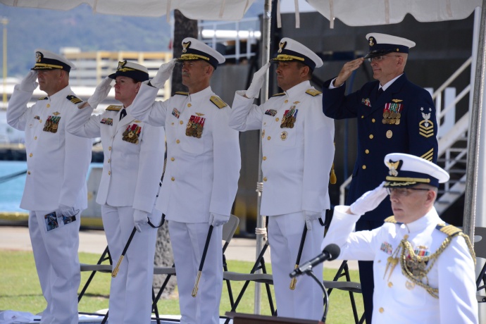 Rear Adm. Vincent B. Atkins assumes command from Rear Adm. Cari B. Thomas as commander of the Fourteenth Coast Guard District during a change of command ceremony at Base Honolulu May 28, 2015. Vice Adm. Charles W. Ray, commander, Pacific Area, presided over the ceremony. The change of command ceremony is a time-honored tradition transferring total responsibility, authority and accountability from one individual to another. (U.S. Coast Guard photo by Petty Officer 3rd Class Melissa E. McKenzie)