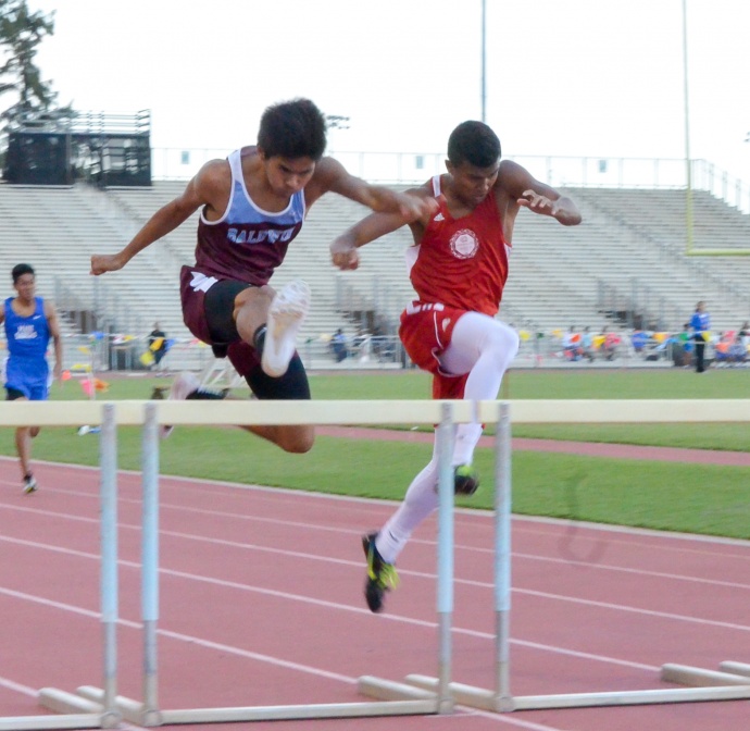 Baldwin's Kiernan Mateo beats Lahainaluna's Emerson Liburd in the 300 hurdles. Liburd, however, beat Mateo in the 110 highs, breaking the meet record of 14.64 with a winning time of 14.60. Photo by Rodney S. Yap.