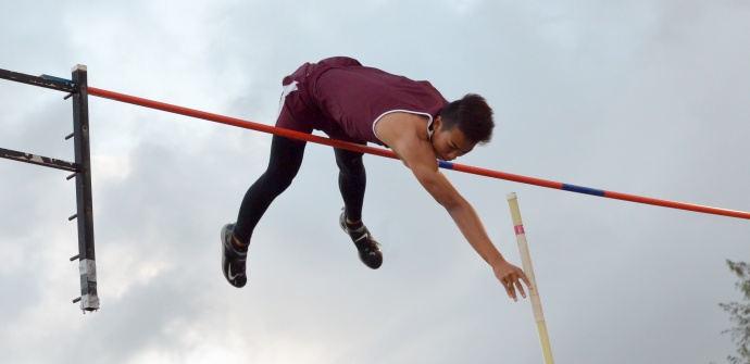 Baldwin's Kainoa Tom won the boys pole vault at 15-3, just missing this attempt at tying the MIL meet record of 15-9. Photo by Rodney S. Yap.