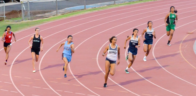 Kihei Charter's Maya Reynolds leads her heat of the girls 200-meter dash at Friday's MIL track and field trials. Photo by Rodney S. Yap.