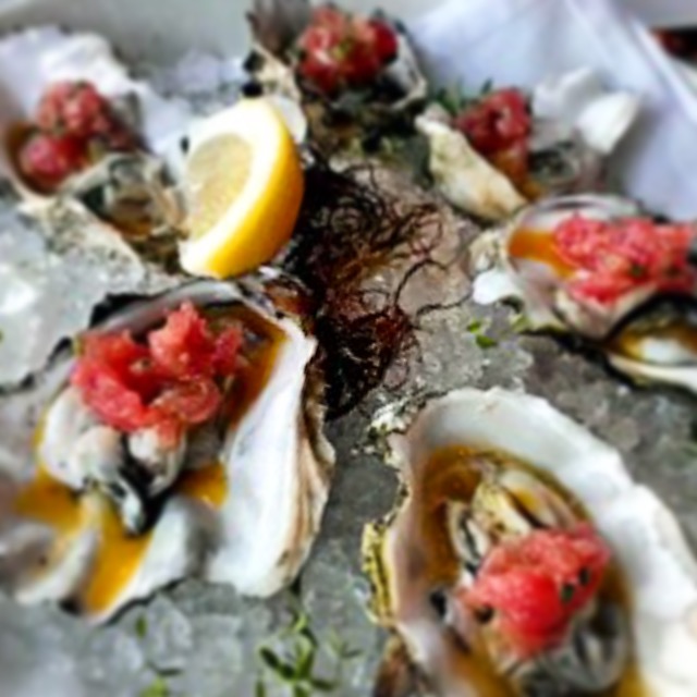 The oysters are topped with ahi, lilikoi and It, Which Will Not Be Named. Photo by Vanessa Wolf