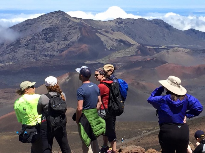 Kevin Kavula with crater visitors. Photo courtesy Haleakalā National Park.