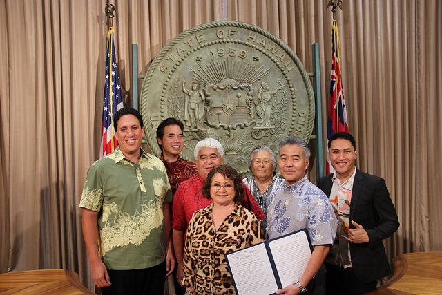 Governor David Ige signs into law HB207 which will require certain state councils, boards, and commissions to attend a course administered by the Office of Hawaiian Affairs on native Hawaiian customs and rights.  Photo credit: Office of the Governor.