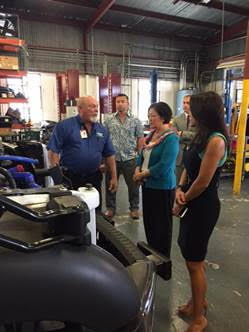 Senator Hirono and Chamber of Commerce Hawaiʻi President Sherry Menor-McNamara are briefed on hydrogen fuel cells by HCATT Director Stan Osserman. Courtesy photo.