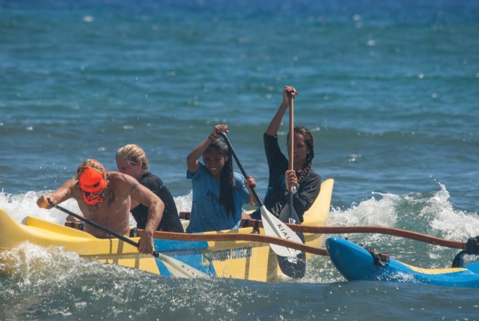Hawaiian Paddle Sports Instructor Mikey Leet, MYFS youth Breanna Racoma and Precious Rayray, and HPS Instructor Rowdey Lindsey