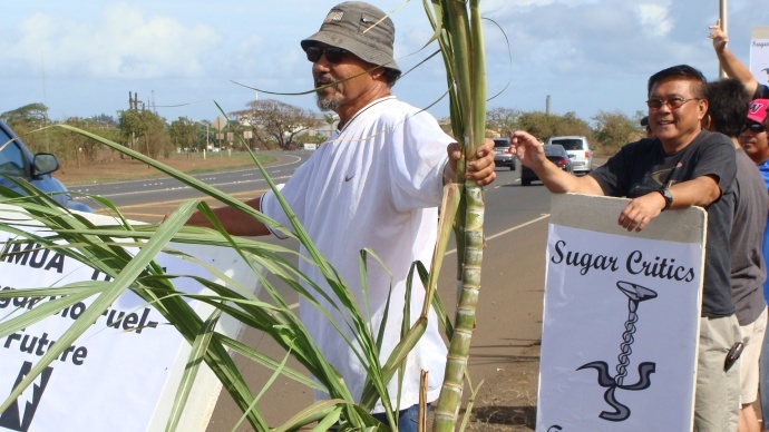 “If those people complain about burning cane–if they can support 800 workers–then they have a right to speak; but my point is who are they to say how to run the lifestyle of the island,” said Charles Jennings, HC&S retiree (front left) during a demonstration backing HC&S's lifestyle and jobs in Sept. 2012. File photo by Wendy Osher.