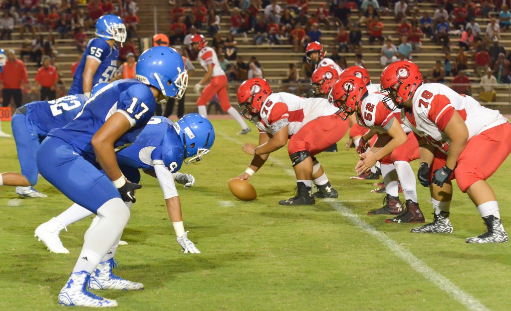 Lahainaluna's offense lines up against Maui High's defense Friday in the second half. Photo by Rodney S. Yap.