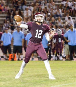 Baldwin's Chayce Akaka releases the first of three touchdown passes to older brother Taje Akaka. Photo by Rodney S. Yap.
