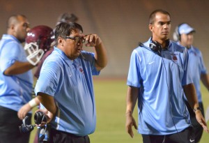 Baldwin head coach Pohai Lee (left) and receivers' coach Colten Quinabo watched the Bears' offense score via the pass four times Saturday against Kamehameha Maui. Photo by Rodney S. Yap.