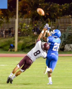 Baldwin defensive back Jansen Roldan (8) breaks up this pass intended for Maui High receiver Justine Dancel (26). Photo by Rodney S. Yap.