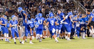 The Maui High School football team celebrate a 3-0 victory over Baldwin Friday night after the sound of the final buzzer at War MemoriL Stadium. Photo by Rodney S. Yap.