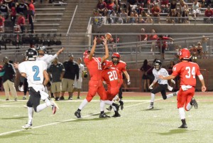 Lahainaluna's Siale Hafokai (15) eyes this would-be interception. Photo by Rodney S. Yap.