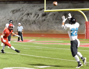 King Kekaulike's Brandon Soriano (22) awaits this pass from quarterback Cameron Russell (5). Photo by Rodney S. Yap.