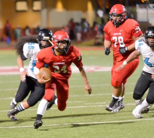 Lahainaluna's Radon Sinenci weaves his way through the Kekaulike defense en route to one of his two touchdown runs. Photo by Rodney S. Yap.