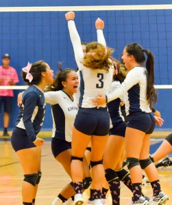 Kamehameha Maui girls volleyball team celebrates after beating King Kekaulike in four sets Friday. Photo by Rodney S. Yap.