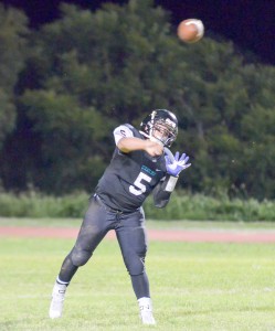 King Kekaulike freshman quarterback Cameron Russell attempts a pass last week against Baldwin High School. File photo by Rodney S. Yap.