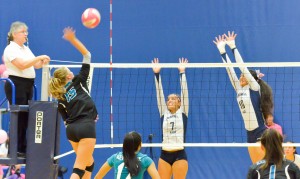 Kamehameha's Danielle Brown attempts to block a shot by King Kekaulike's Chandler Cowell (5). Photo by Rodney S. Yap.
