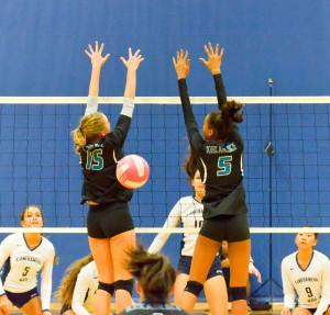 Kamehameha's Kanilea Nomura watches as her kill shot goes past the block of King Kekaulike's Chandler Cowell (5) and Rose Love (5). Photo by Rodney S. Yap.