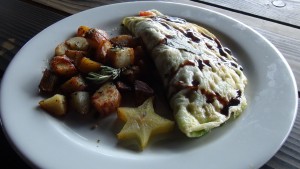 Omelette and breakfast potatoes sprinkled with nori furikake at Nalu's South Shore Grill. Photo by Kiaora Bohlool.