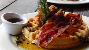 Chicken and waffles with bacon at Nalu's South Shore Grill. Photo by Kiaora Bohlool.