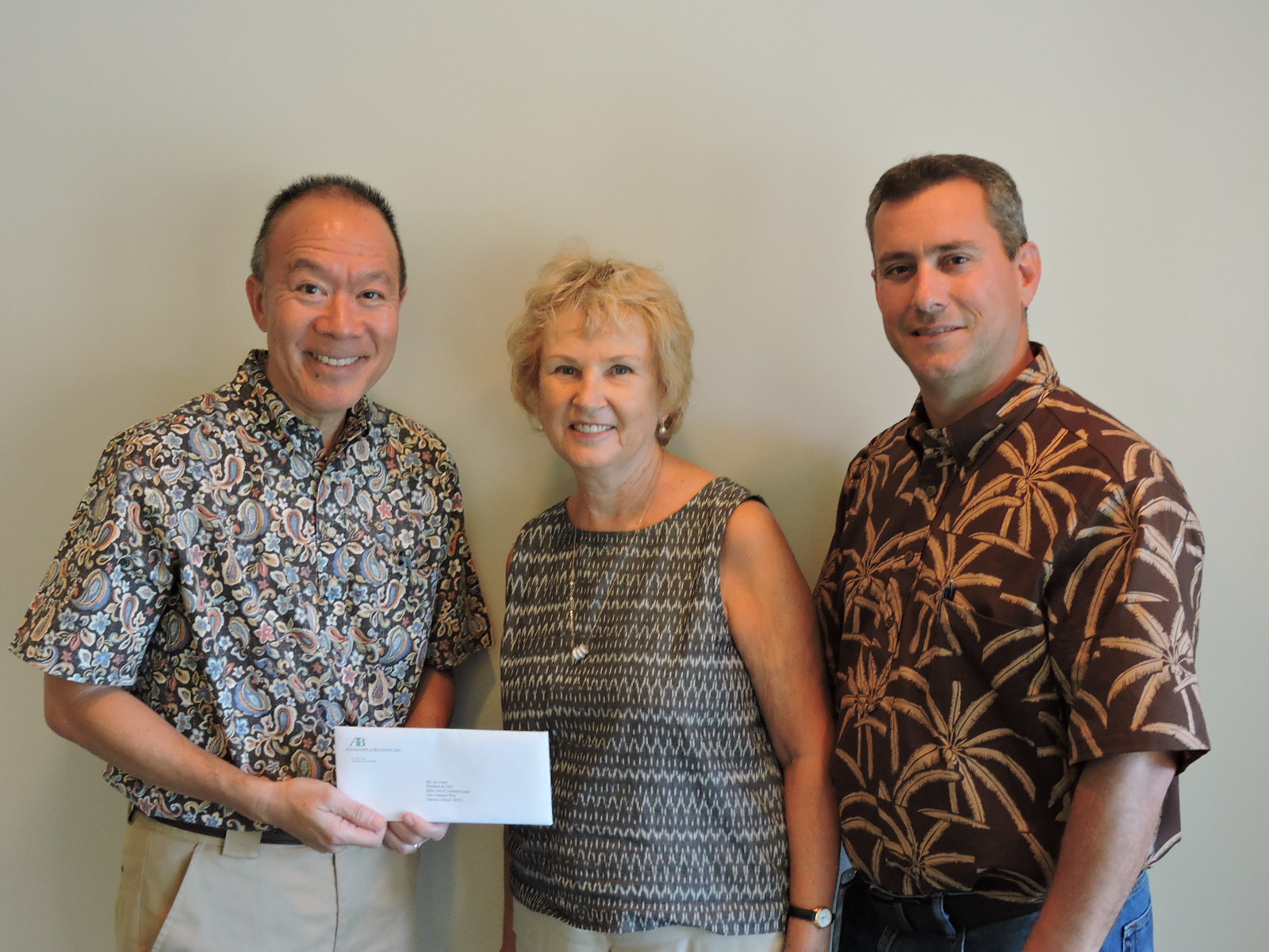 Susana Browne of MACC with Grant Y.M. Chun (A&B Properties) left, and Rick Volner, Jr. (HC&S). Alexander & Baldwin has given $10,000 to support Maui Arts & Cultural Center’s “CanDo! Days” - a well-known and much-loved facet of The MACC’s overall arts education program. Arts education at The MACC extends the learning potential of more than 10,000 Maui County students annually.