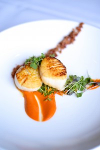 Pan-seared New Bedford scallops w/ paquillo pepper romesco & applewood- smoked bacon. Photo courtesy of Fleetwood's on Front Street.